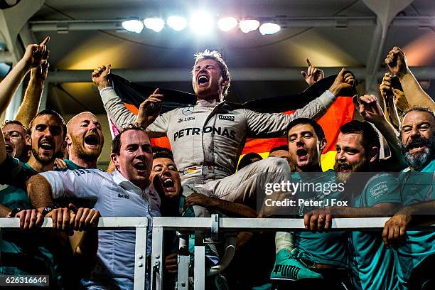 Nico Rosberg of Germany and Mercedes celebrates with his team after becoming the 2016 F1 World Drivers Champion during the Abu Dhabi Formula One...