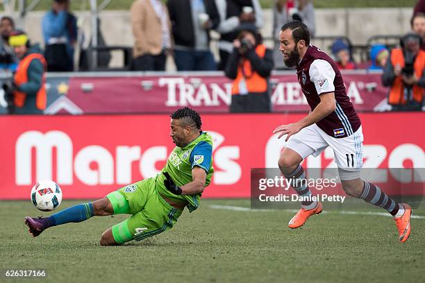 Tyrone Mears of the Seattle Sounders controls the ball as Shkelzen Gashi of the Colorado Rapids looks on during first half of the second leg of the...