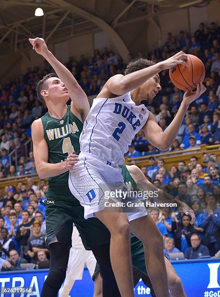 Chase Jeter of the Duke Blue Devils rebounds against Omar Prewitt of the William & Mary Tribe during the game at Cameron Indoor Stadium on November...