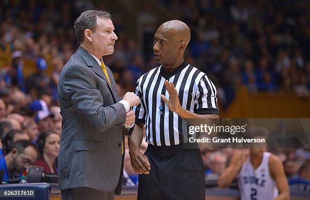 Head coach Tony Shaver of the William & Mary Tribe talks with an official during the game against the Duke Blue Devils at Cameron Indoor Stadium on...