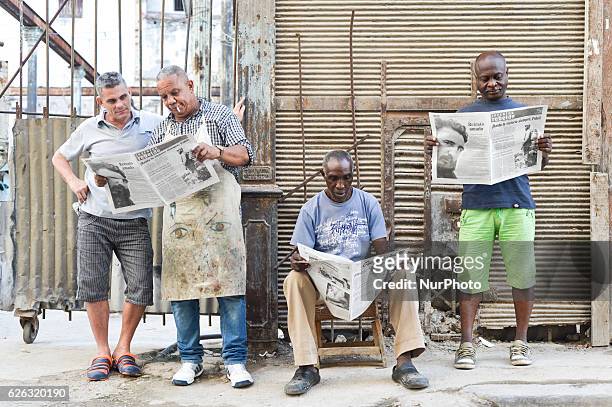 People read the latest newspapers, a scene from a daily life in Havana on November 26 the next day after Fidel Castro, Cuba's historic revolutionary...