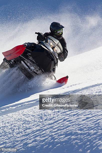 snowmobile canada - snow vehicle stock pictures, royalty-free photos & images