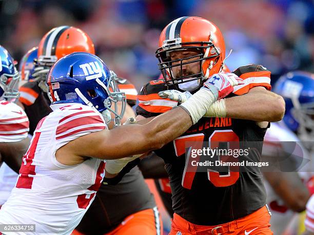 Left tackle Joe Thomas of the Cleveland Browns engages with defensive end Olivier Vernon of the New York Giants during a game on November 27, 2016 at...