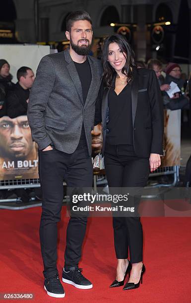 Olivier Giroud and Jennifer Giroud attend the World Premiere of "I Am Bolt" at Odeon Leicester Square on November 28, 2016 in London, England.