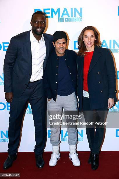Actor of the movie Omar Sy, humorist Jamel Debbouze and his wife Melissa Theuriau attend the "Demain Tout Commence" Paris Premiere at Cinema Le Grand...