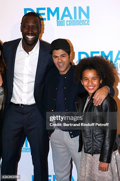 Actor of the movie Omar Sy, humorist Jamel Debbouze and actress of the movie Gloria Colston attend the "Demain Tout Commence" Paris Premiere at...