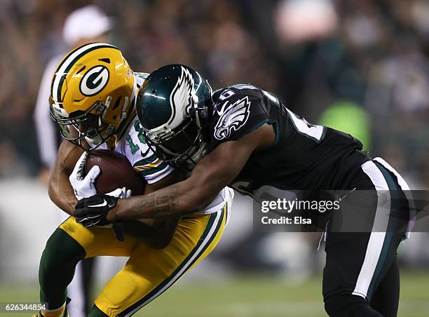 Randall Cobb of the Green Bay Packers catches a pass and is tackled by Jaylen Watkins of the Philadelphia Eagles in the first quarter at Lincoln...