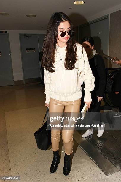 Selena Gomez is seen at LAX on November 28, 2016 in Los Angeles, California.