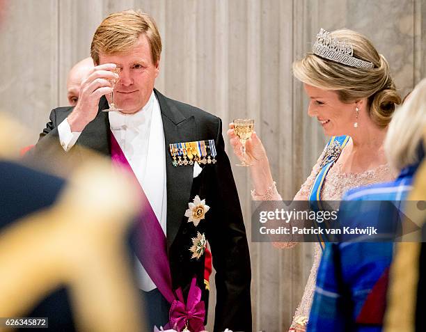 Queen Mathilde and King Willem-Alexander during the state banquet for the Belgian King and Queenon November 28, 2016 in Amsterdam, Netherlands.