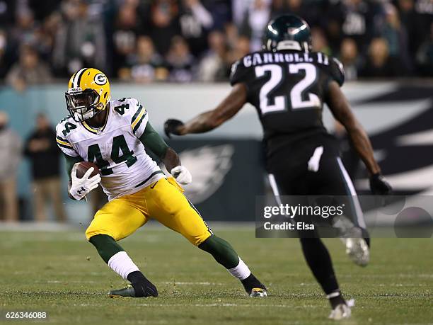 James Starks of the Green Bay Packers runs with the ball against Nolan Carroll of the Philadelphia Eagles in the second quarter at Lincoln Financial...