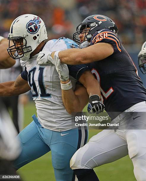 Derrick Morgan of the Tennessee Titans rushes against Logan Paulsen of the Chicago Bears at Soldier Field on November 27, 2016 in Chicago, Illinois....