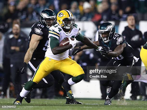 James Starks of the Green Bay Packers runs the ball against Connor Barwin and Jaylen Watkins of the Philadelphia Eagles in the first quarter at...