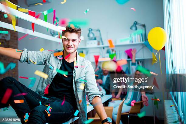 young man at the birthday party - excitement confetti stock pictures, royalty-free photos & images