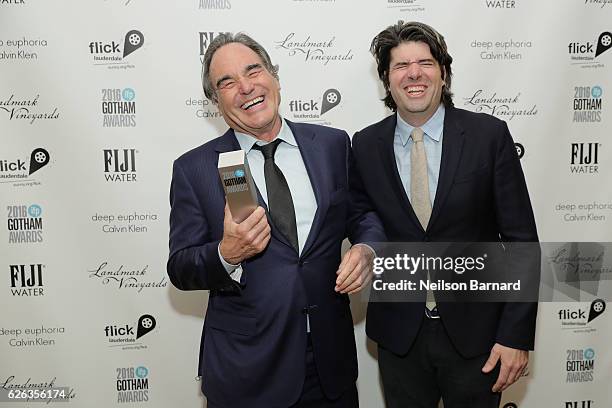Oliver Stone and JC Chandor pose backstage during IFP's 26th Annual Gotham Independent Film Awards at Cipriani, Wall Street on November 28, 2016 in...