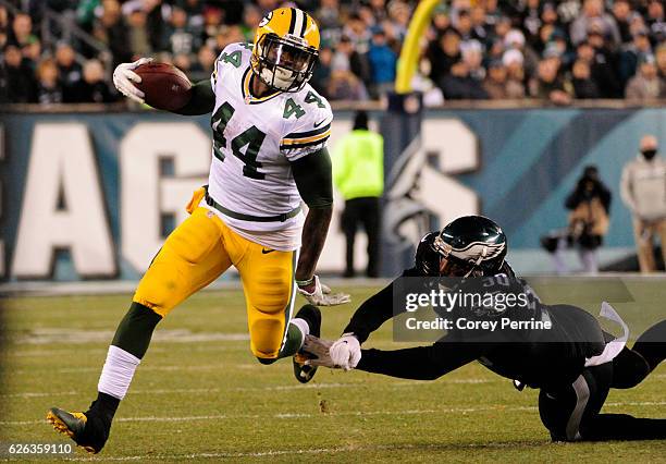 James Starks of the Green Bay Packers outruns Marcus Smith of the Philadelphia Eagles in the second half at Lincoln Financial Field on November 28,...