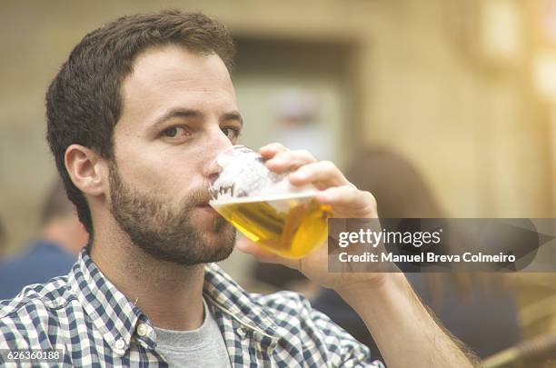 young man drinking beer - drinking problem stock pictures, royalty-free photos & images