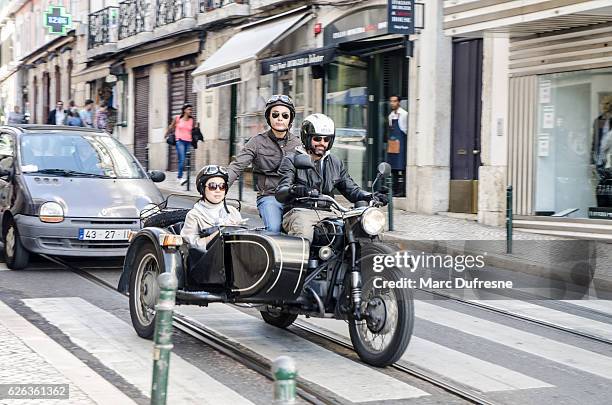 three people passing by in a sidecar motorcycle - motorcycle side car stock pictures, royalty-free photos & images