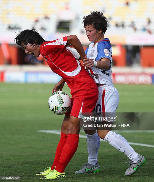 Katie Cousins of United States tries to tackle Ju Hyo Sim of Korea DPR during the FIFA U-20 Women's World Cup, Semi Final match between Korea DPR and...