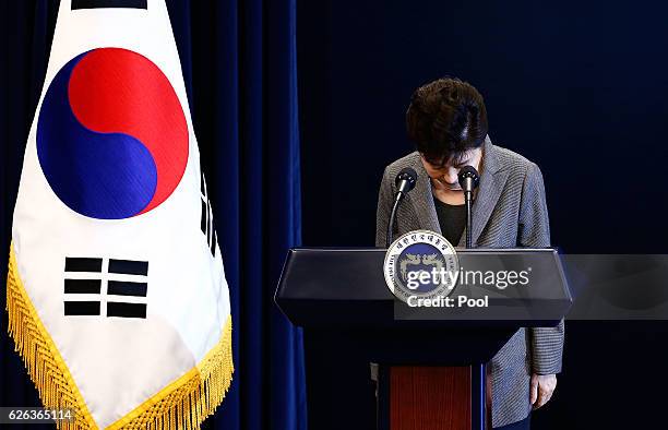 South Korean President Park Geun-Hye bows during an address to the nation, at the presidential Blue House in Seoul on November 29, 2016. South...