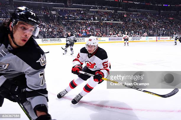 Blake Pietila of the New Jersey Devils battles for the puck against Jordan Nolan of the Los Angeles Kings during the game on November 19, 2016 at...