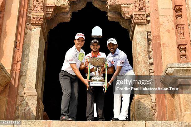 Liang Wenchong of China, Chiragh Kumar of India, defending champion and S.Chikkarangaappa of India pictured at Lodi gardens with the winner's trophy...