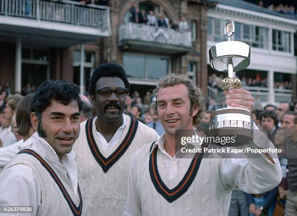 Lancashire captain David Lloyd lifts the Gillette Cup with team-mates Farokh Engineer and Clive Lloyd after Lancashire beat Middlesex in the Gillette...