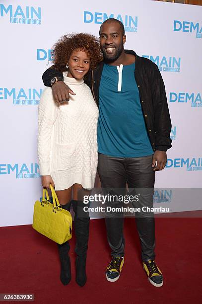 Teddy Riner and Luthna Plocus attend the "Demain Tout Commence" Paris Premiere at Le Grand Rex on November 28, 2016 in Paris, France.