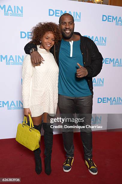 Teddy Riner and Luthna Plocus attend the "Demain Tout Commence" Paris Premiere at Le Grand Rex on November 28, 2016 in Paris, France.
