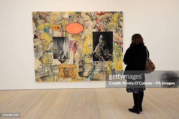 Woman views a piece by David Salle titled Mingus in Mexico at a photo call and press view for the Saatchi Gallery&acirc;ÂÂs winter exhibition...