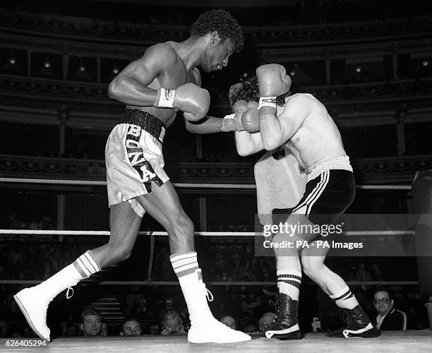 Britain's Cornelius Boza-Edwards unleashes a barrage that causes defending champion Carlos Hernandez, of Spain, to defend during the European Super...