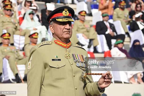 Handout picture released by Pakistan's Inter-Services Public Relations shows outgoing Pakistan army chief General Raheel Sharif hands over change of...