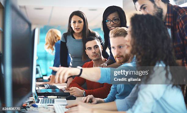 application developers at work. - employment standards stock pictures, royalty-free photos & images