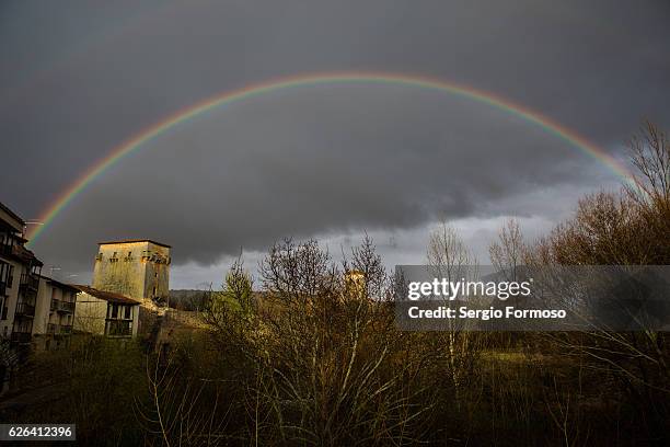 rainbow over covarrubias, burgos, spain - covarrubias stock pictures, royalty-free photos & images