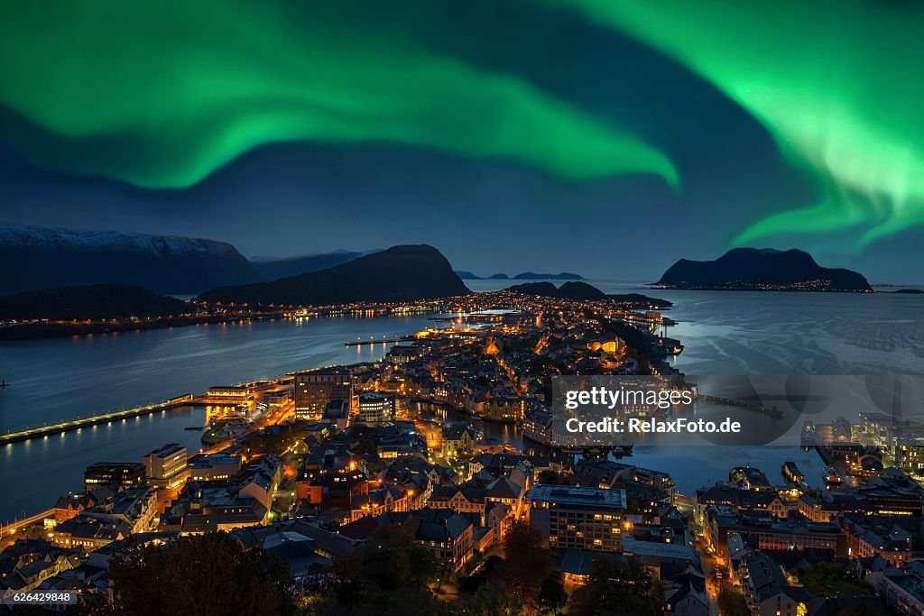 Northern lights - Green Aurora borealis over Alesund, Norway