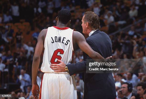 Guard Eddie Jones of the Miami Heat listens to head coach Pat Riley during the NBA game against the Minnesota Timberwolves at American Airlines...