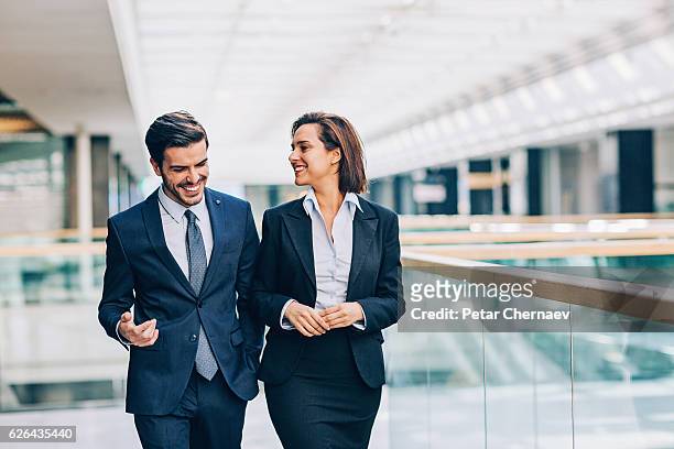 discussing the business - business couple stockfoto's en -beelden