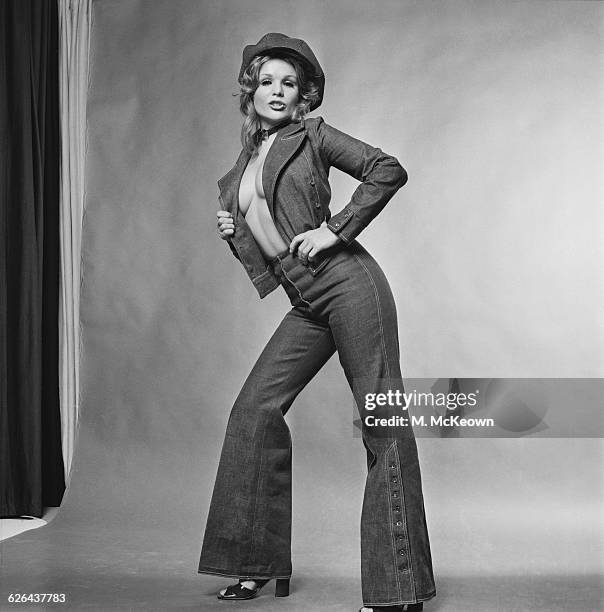 English actress and model Vivien Neves wearing a denim outfit of flared trousers and matching jacket, 25th February 1971.