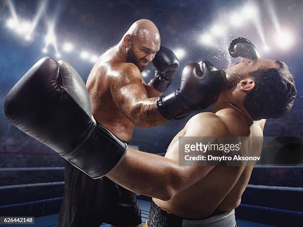 boxing: extremely powerful punch - punching stock pictures, royalty-free photos & images