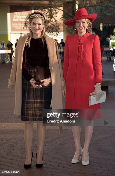 Queen Maxima of Netherlands and Queen Mathilde of Belgium pose as they visit the exhibition of the artist Pierre Alechinsky at the museum Cobra in...