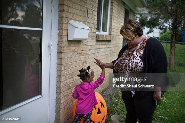 Sonya Ebhotemen enjoys playing tag with her grandchild in her front yard. As a Marine Corps veteran living with post-traumatic stress disorder ,...