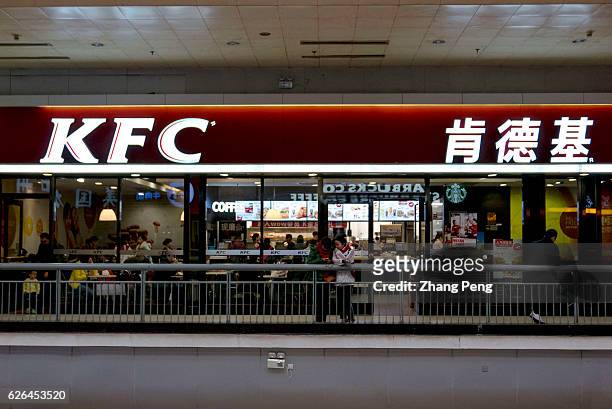 Chinese customers have dinner in a KFC restaurant in Beijing West railway station. As the largest restaurant chain in China, with more than 7,000...