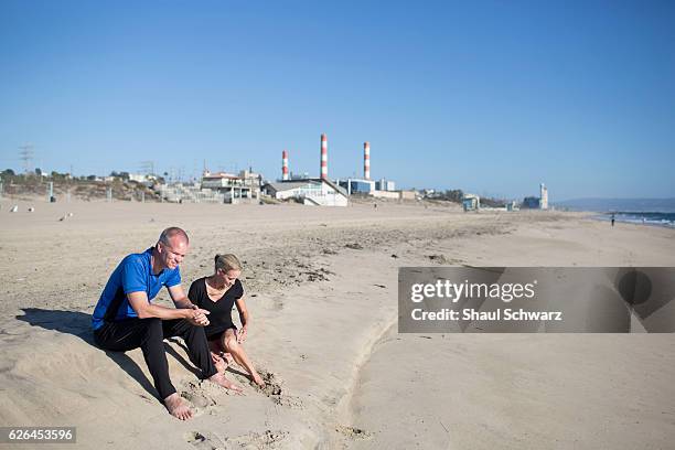 Suzy Favor Hamilton and her husband relax on the beach. Suzy is a three-time Olympian, writer, advocate, wife and mother. With incredible support...