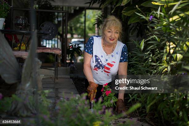 Terry Taggart gardens outside her home. Terry lives with bipolar disorder and post-traumatic stress disorder . She devotes her time to two very...