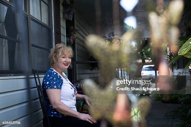 Terry Taggart sits outside her home. Terry lives with bipolar disorder and post-traumatic stress disorder . She devotes her time to two very...