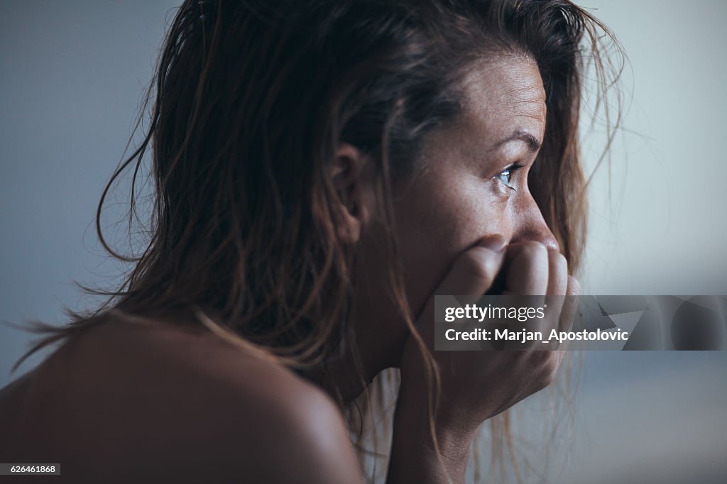 Woman sitting alone and depressed