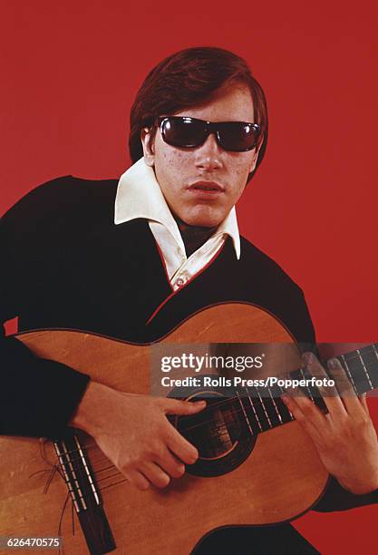 Puerto Rican born singer and guitarist Jose Feliciano pictured playing an acoustic guitar in 1969.