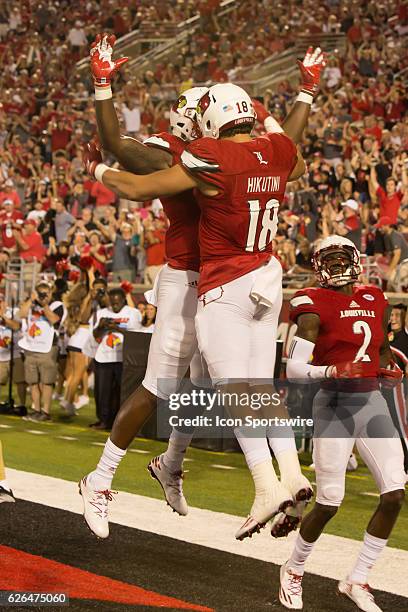 Louisville tight end Cole Hikutini celebrates a touchdown during the 2nd half of the NCAA football game between the Louisville Cardinals and the...