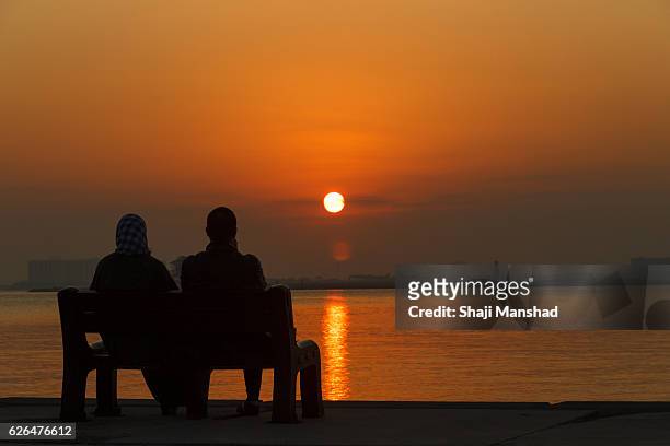 couple and lady watching sunrise - beautiful arabian girls stock pictures, royalty-free photos & images