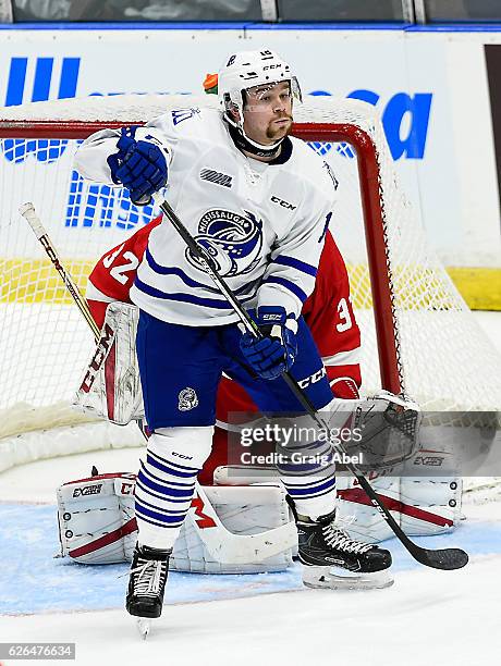 Aiden McFarland of the Mississauga Steelheads puts a screen on goalie Joseph Raaymakers of the Sault Ste. Marie Greyhounds during game action on...