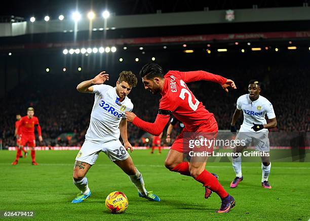 Emre Can of Liverpool takes on Gaetano Berardi of Leeds United during the EFL Cup Quarter-Final match between Liverpool and Leeds United at Anfield...